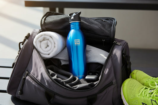 An ONYA, 1 litre, stainless steel, BPA and aluminium free, durable drink bottle in a gym bag. Blue variant.
