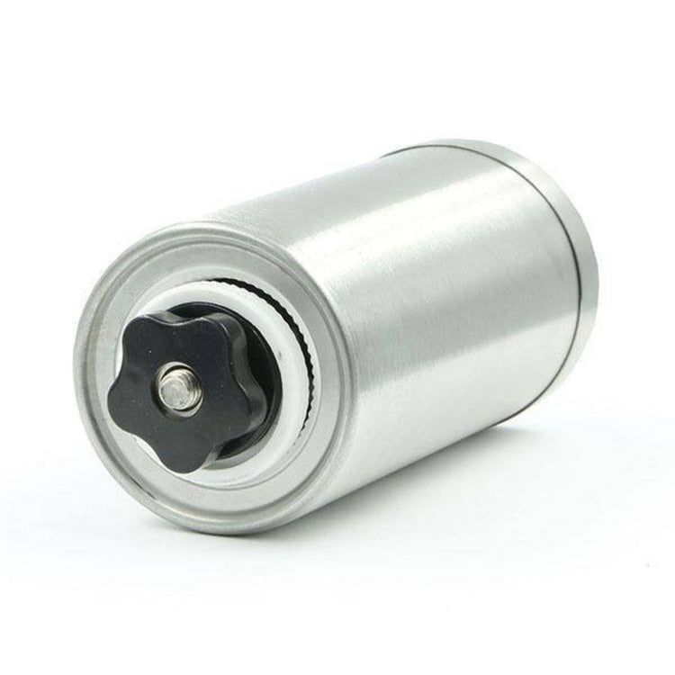 The inner components and adjustable ceramic burr mill mechanism of a manual coffee grinder arranged on a white background.