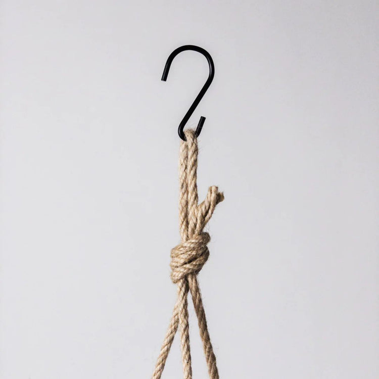 Potted hanging mechanism showing fine woven hemp rope and metal S hook on a clean white background.