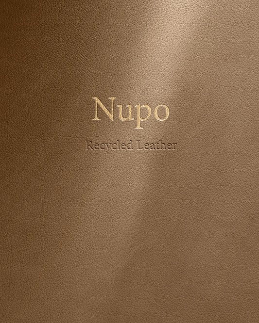 Brown leather surface with 'Nupo Recycled Leather' embossed text