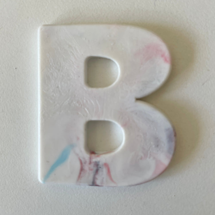 Custom recycled plastic house number for letterboxes white variant letter B.