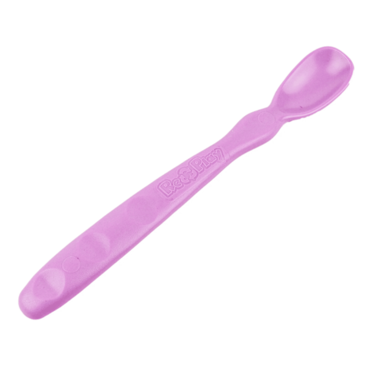 Close up view of the smooth rounded contour edges and gentle deep scoop depth on a non toxic infant weaning spoon in Purple.