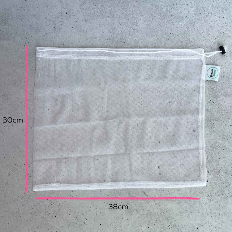 Close up detail of a durable woven rPET mesh bag showing the premium stitching, easy machine wash care, and zero waste design.