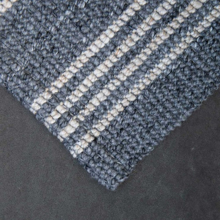 Close-up texture detail of the mould and fade resistant recycled plastic woven yarn on a Zebra Home doormat.