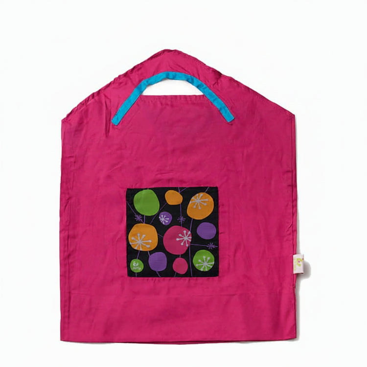 Onya reusable shopping bag with built in shoulder strap and checkout caddy loops next to its attached compact pouch on a clean white background, available in Australia in pink retro small variant.