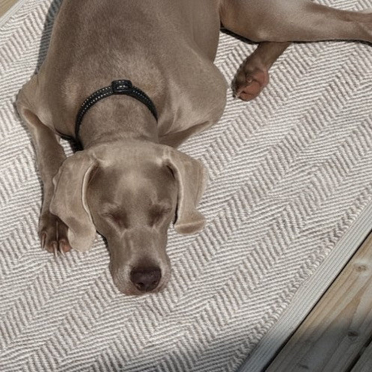 Davis grey herringbone recycled plastic outdoor runner styled on a sunny timber patio deck in Australia.