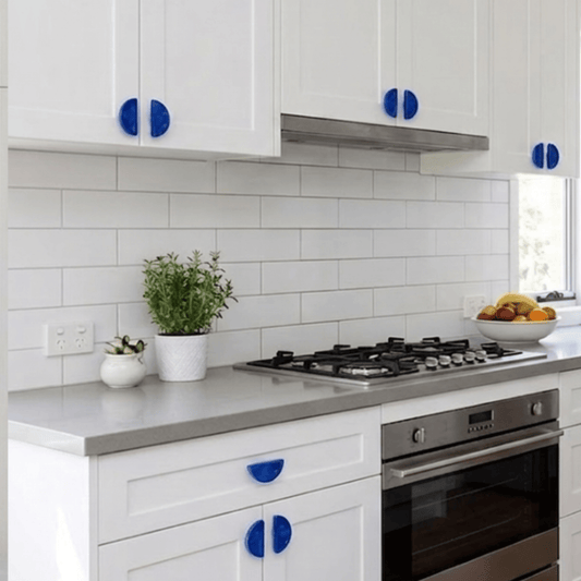Blue recycled plastic semi circle handles installed in a modern kitchen.