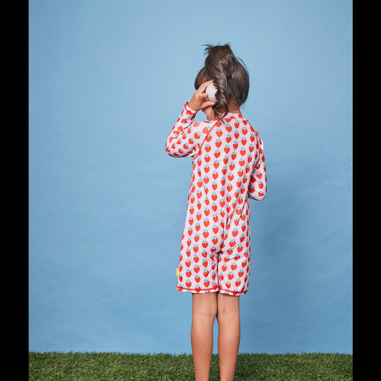 Back view of a child wearing the long sleeve strawberry swim sunsuit for sun smart UV protection in Australia.