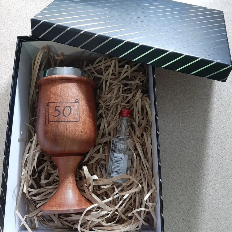 Close-up of the elegant turned stem and natural wood grain of a sustainable timber wine chalice made in Jindera, New South Wales showing personalisation.