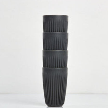 Large 12oz HuskeeOriginal reusable coffee cup featuring the signature vertical ribbed design made from sustainable coffee husk waste in charcoal 4 pack.