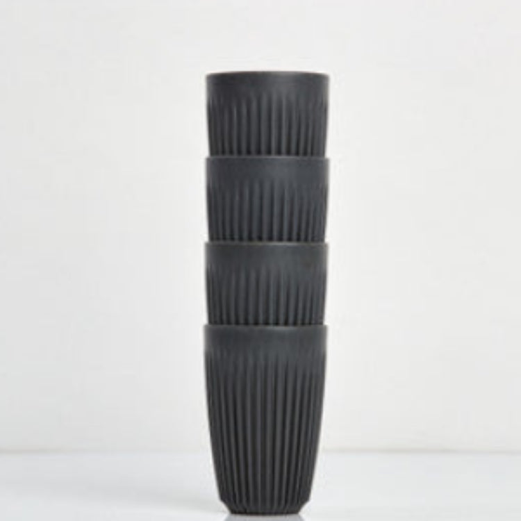 Large 12oz HuskeeOriginal reusable coffee cup featuring the signature vertical ribbed design made from sustainable coffee husk waste in charcoal 4 pack.
