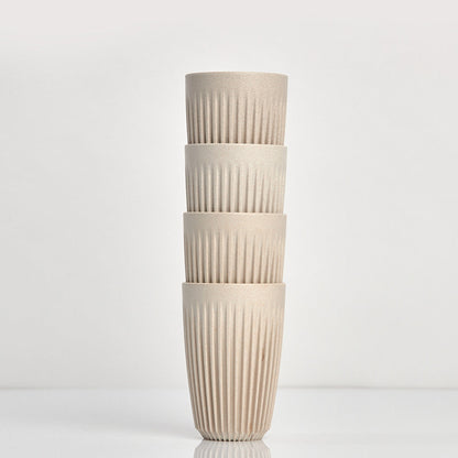 Large 12oz HuskeeOriginal reusable coffee cup featuring the signature vertical ribbed design made from sustainable coffee husk waste in natural 4 pack.