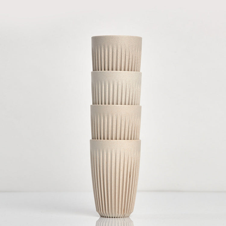 Large 12oz HuskeeOriginal reusable coffee cup featuring the signature vertical ribbed design made from sustainable coffee husk waste in natural 4 pack.