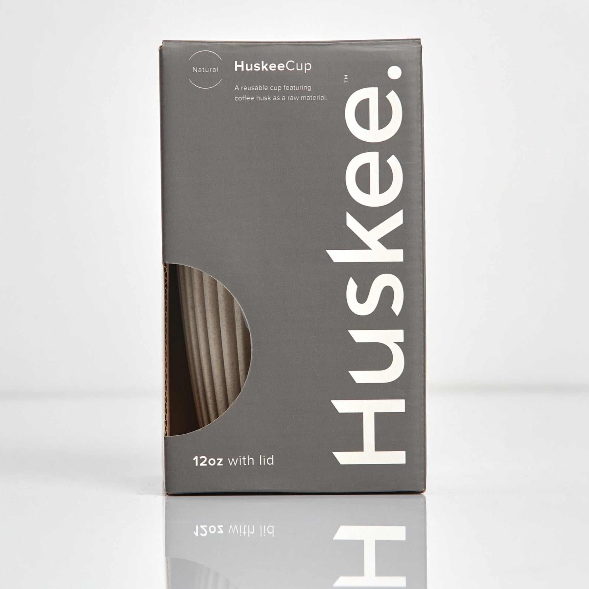 Large 12oz HuskeeOriginal reusable coffee cup featuring the signature vertical ribbed design made from sustainable coffee husk waste in natural in box.