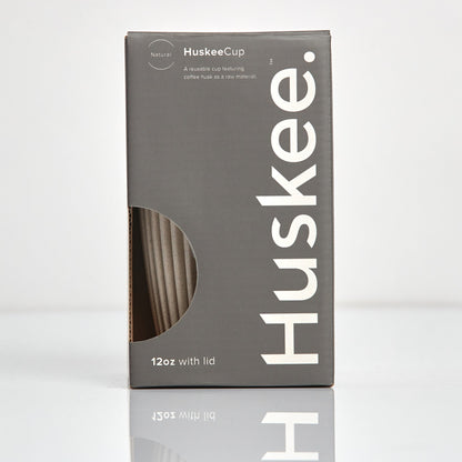 Large 12oz HuskeeOriginal reusable coffee cup featuring the signature vertical ribbed design made from sustainable coffee husk waste in natural in box.