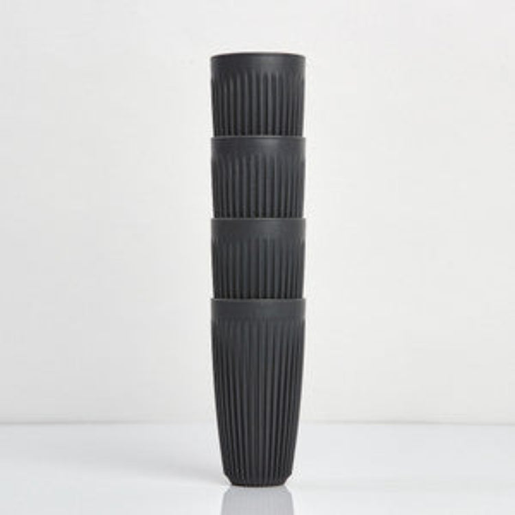 Extra large 16oz HuskeeOriginal reusable coffee cup featuring the signature vertical ribbed design made from sustainable coffee husk waste in charcoal 4 pack.