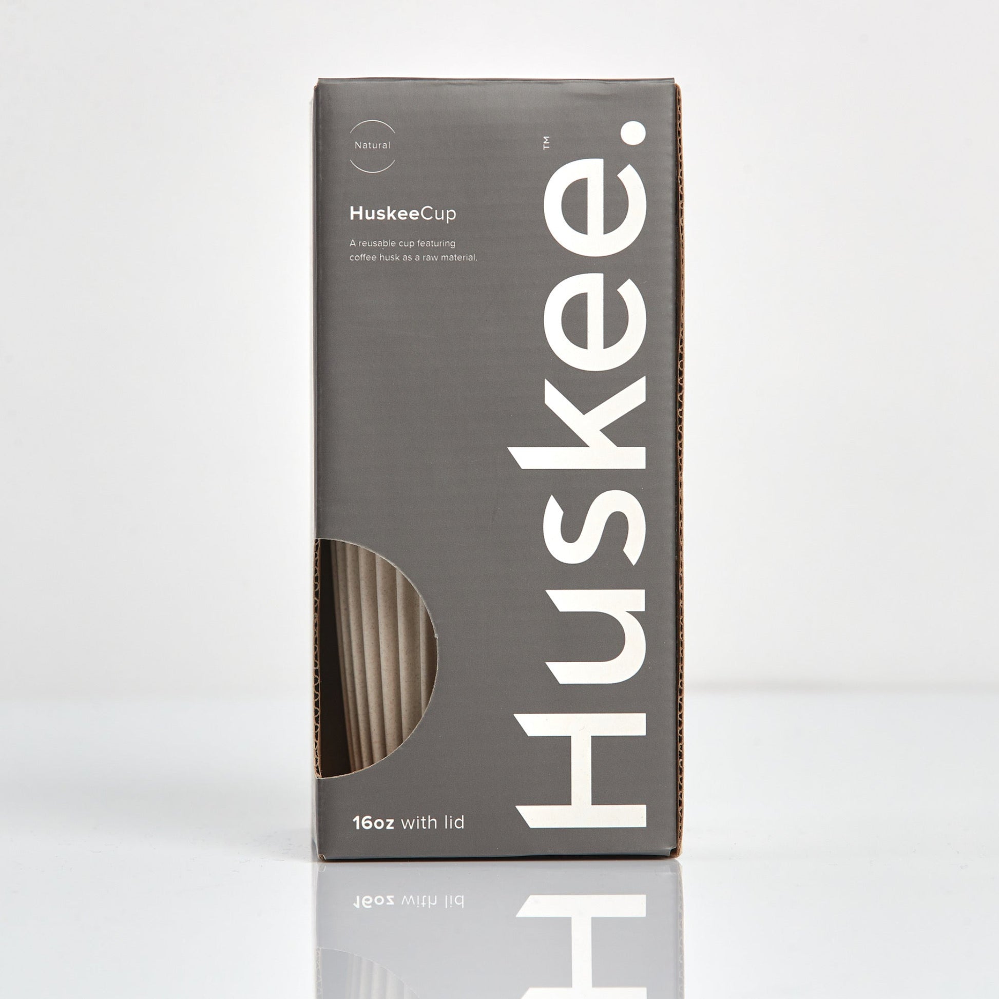 Extra large 16oz HuskeeOriginal reusable coffee cup featuring the signature vertical ribbed design made from sustainable coffee husk waste in natural in box.
