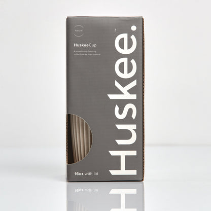 Extra large 16oz HuskeeOriginal reusable coffee cup featuring the signature vertical ribbed design made from sustainable coffee husk waste in natural in box.