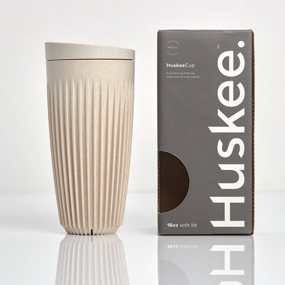 Extra large 16oz HuskeeOriginal reusable coffee cup featuring the signature vertical ribbed design made from sustainable coffee husk waste in natural with box.