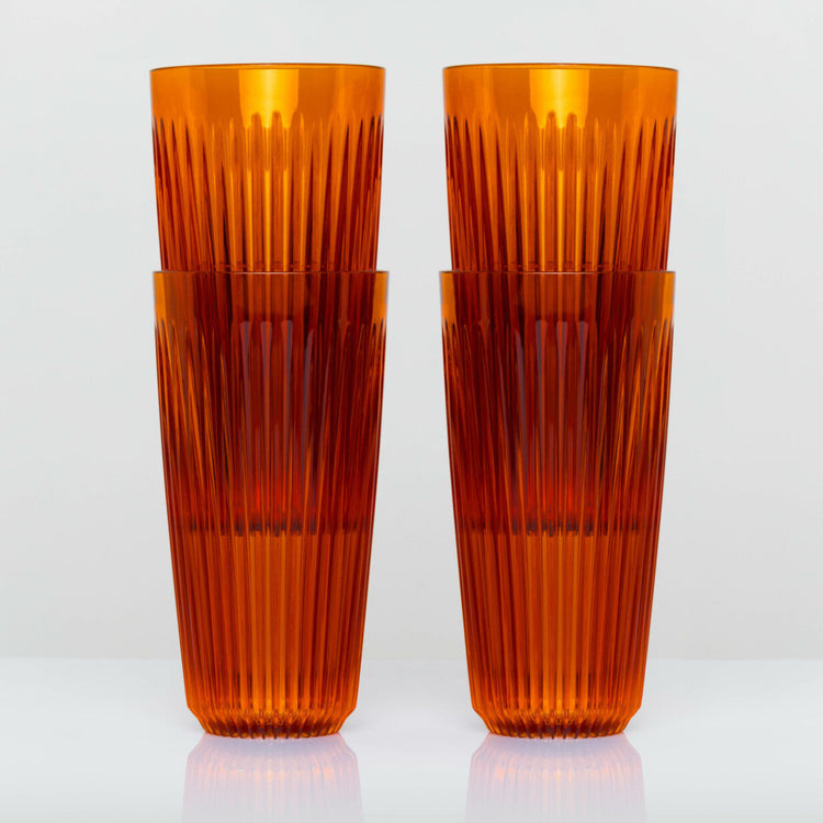 Extra large 16oz HuskeeRenew translucent reusable coffee cup featuring the signature vertical ribbed design made from high-performance recycled polymer in amber 4 pack.