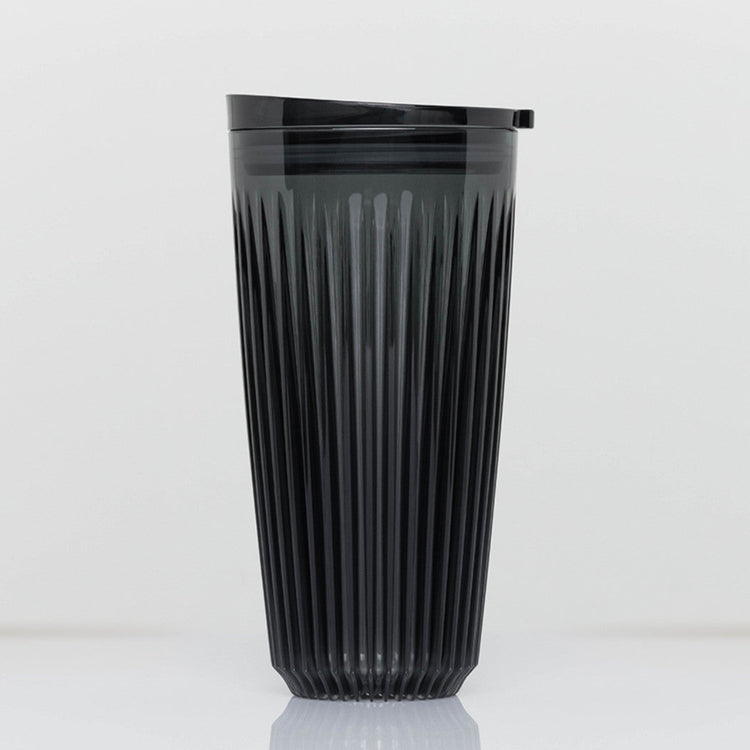 Extra large 16oz HuskeeRenew translucent reusable coffee cup featuring the signature vertical ribbed design made from high-performance recycled polymer  in smoke.