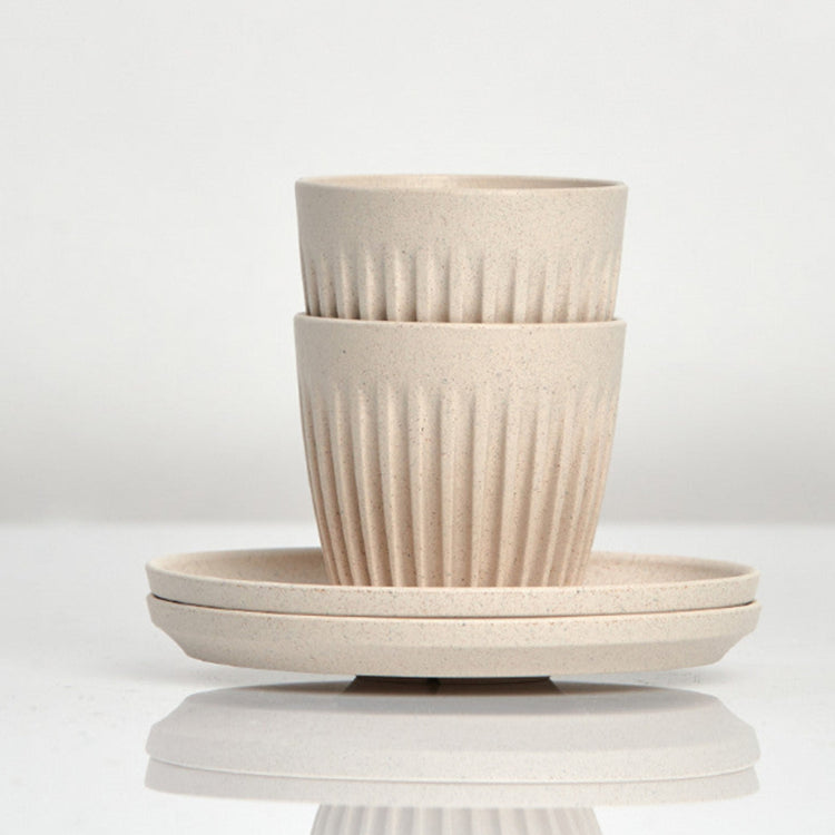 Set of 2 small 3oz HuskeeOriginal reusable espresso cups with saucers featuring the signature vertical ribbed design made from organic coffee husk waste in natural.