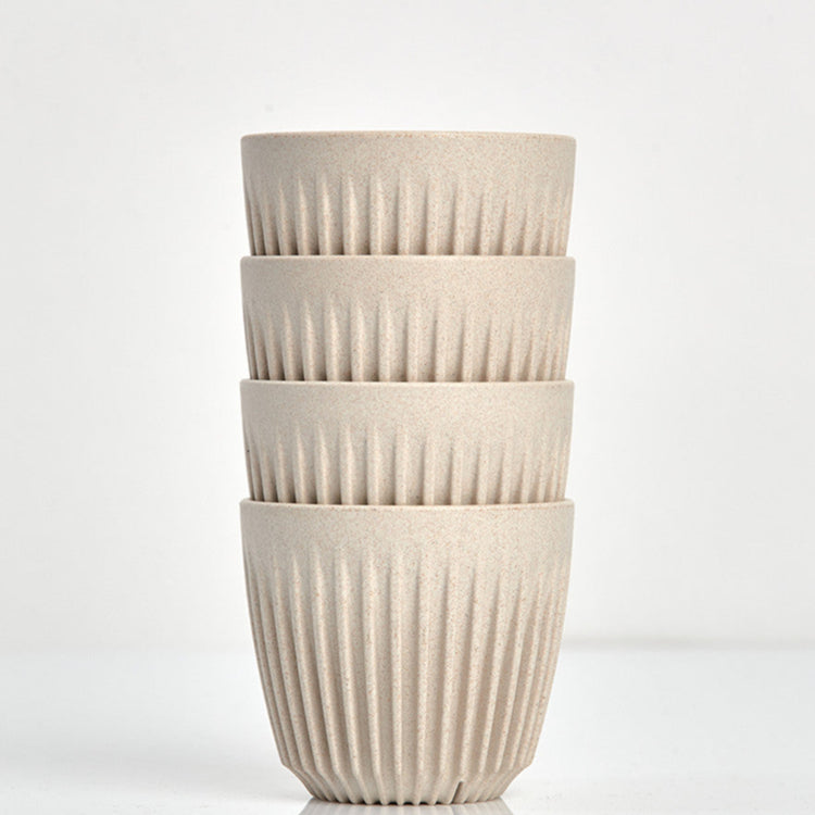 A 6oz HuskeeOriginal reusable coffee cup featuring the signature ribbed design made from coffee husk waste natural 4 pack.