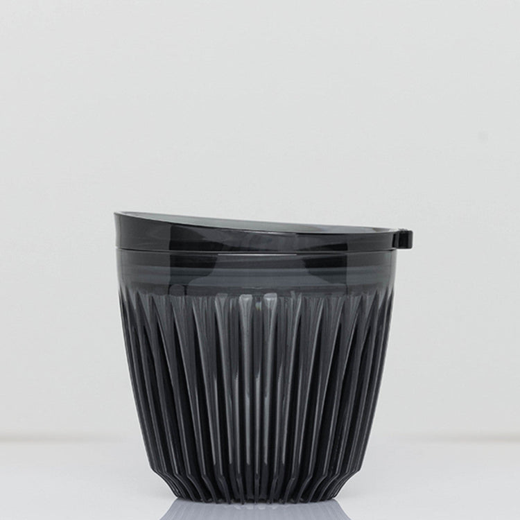 A small 6oz HuskeeRenew translucent reusable coffee cup made from high-performance recycled polymer in smoke.