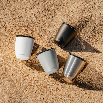Four 6oz HuskeeSteel reusable coffee cups with matching stopper lid made from 91% recycled stainless steel in four colours.