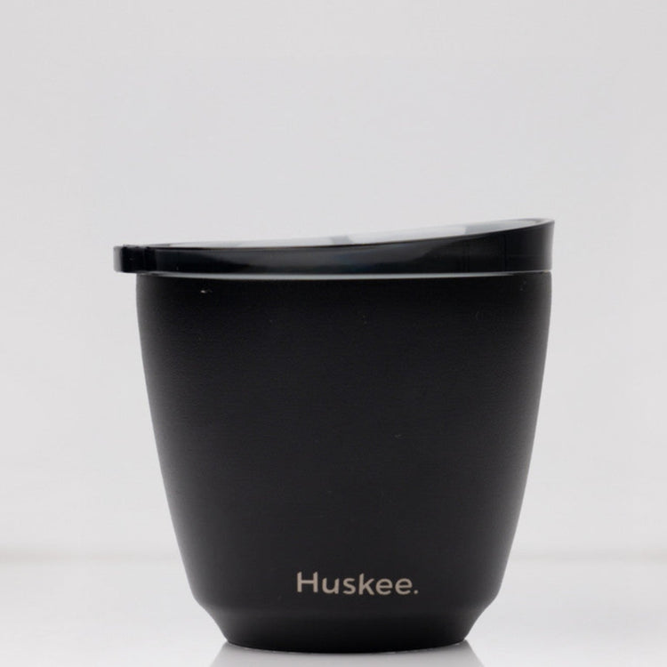 Small 6oz HuskeeSteel reusable coffee cup with matching stopper lid made from vacuum insulated stainless steel in black.