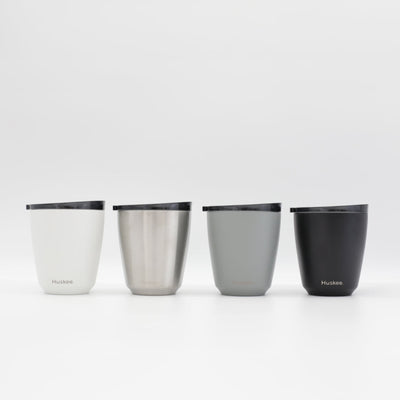 Four 6oz HuskeeSteel reusable coffee cups with matching stopper lid in the four colours available.