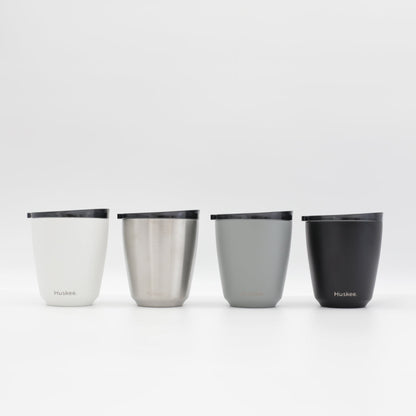 Four 6oz HuskeeSteel reusable coffee cups with matching stopper lid in the four colours available.