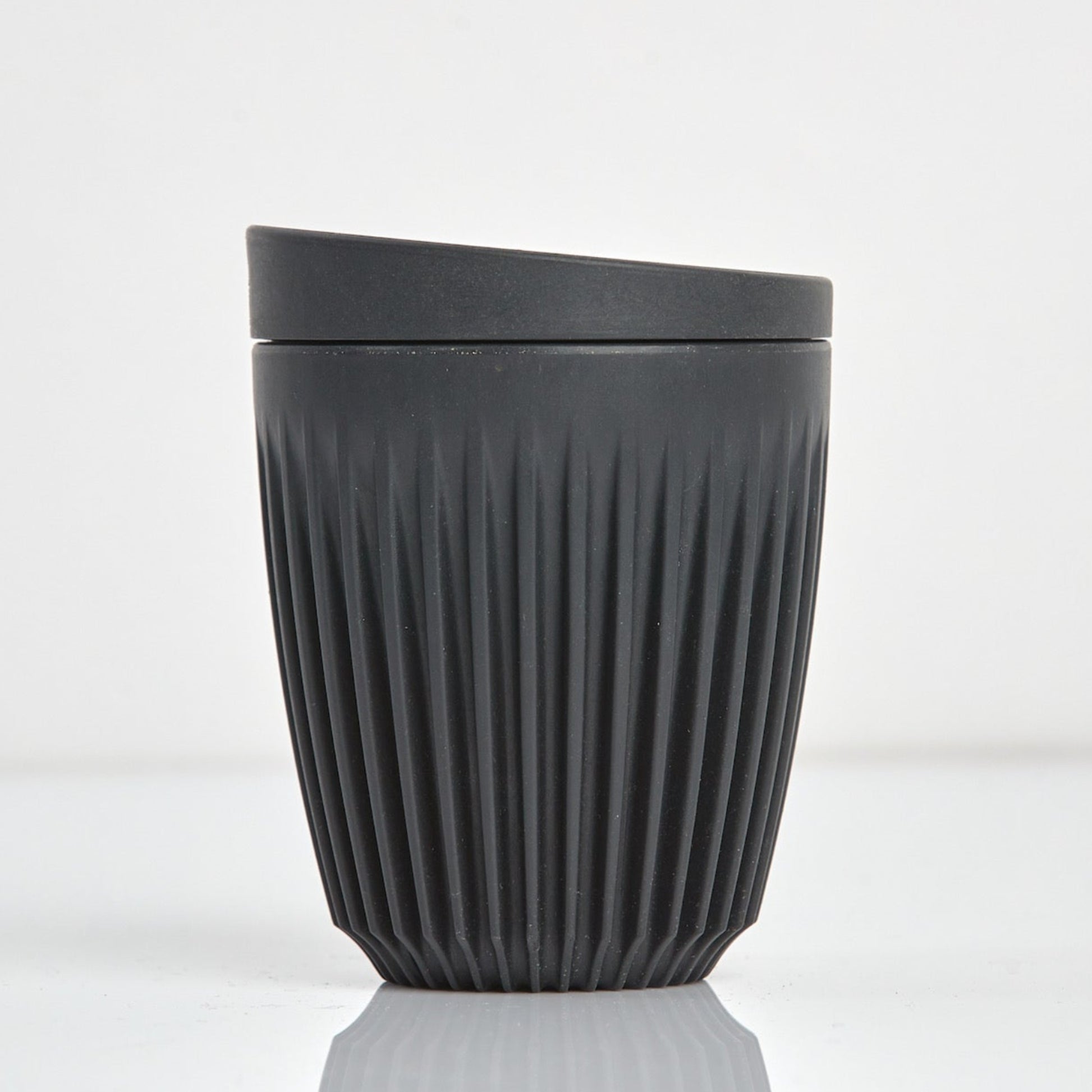 Standard 8oz HuskeeOriginal reusable coffee cup featuring the signature vertical ribbed design made from sustainable coffee husk waste n charcoal.
