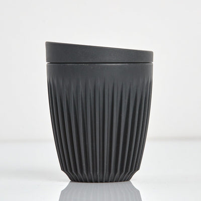 Standard 8oz HuskeeOriginal reusable coffee cup featuring the signature vertical ribbed design made from sustainable coffee husk waste n charcoal.