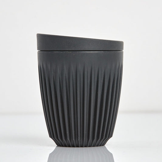 Standard 8oz HuskeeOriginal reusable coffee cup featuring the signature vertical ribbed design made from sustainable coffee husk waste n charcoal.