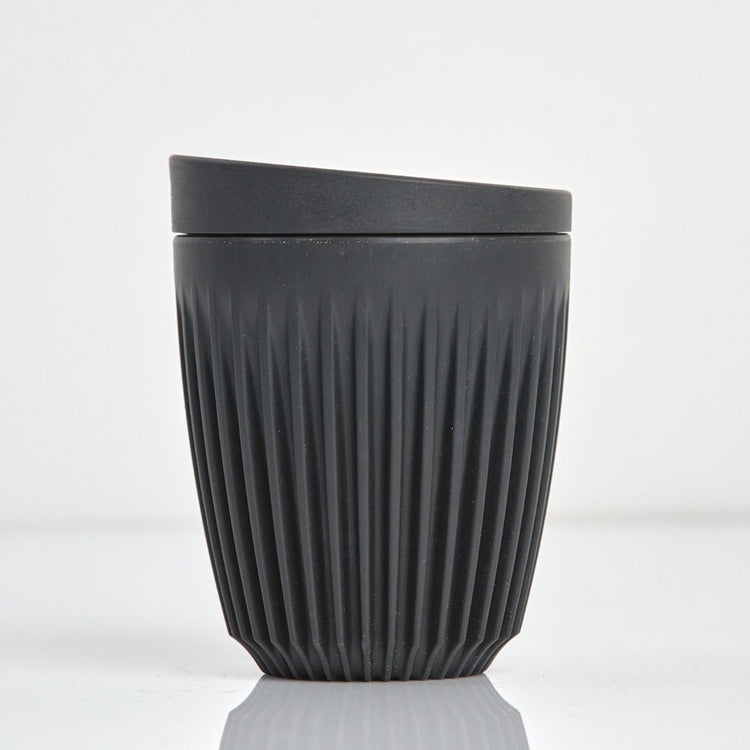 Standard 8oz HuskeeOriginal reusable coffee cup featuring the signature vertical ribbed design made from sustainable coffee husk waste n charcoal.