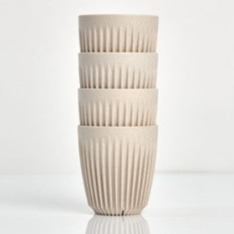 Standard 8oz HuskeeOriginal reusable coffee cup featuring the signature vertical ribbed design made from sustainable coffee husk waste in natural 4 pack.