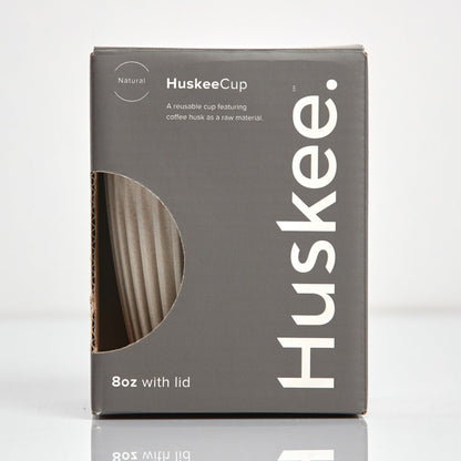 Standard 8oz HuskeeOriginal reusable coffee cup featuring the signature vertical ribbed design made from sustainable coffee husk waste in natural in box.