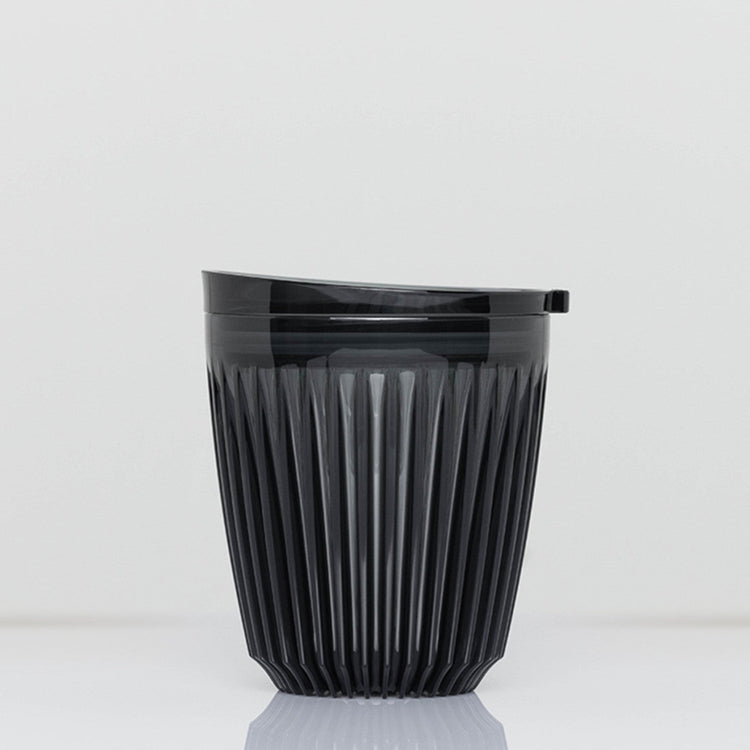Standard 8oz HuskeeRenew translucent reusable coffee cup featuring the signature vertical ribbed design made from high-performance recycled polymer in smoke.