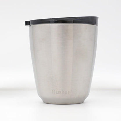Standard 8oz HuskeeSteel reusable coffee cup with matching stopper lid made from 91% recycled vacuum insulated stainless steel in steel.
