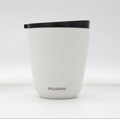 Standard 8oz HuskeeSteel reusable coffee cup with matching stopper lid made from 91% recycled vacuum insulated stainless steel in white.