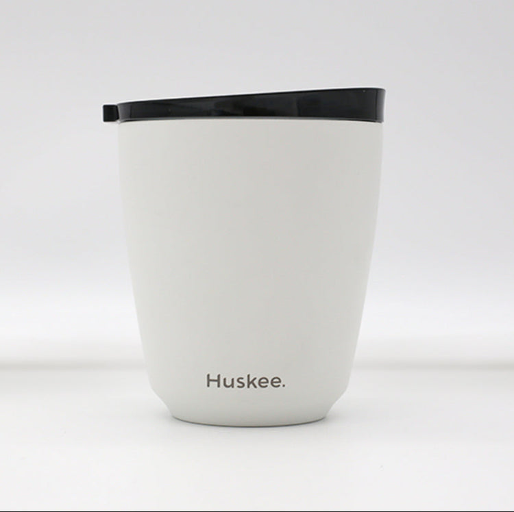 Standard 8oz HuskeeSteel reusable coffee cup with matching stopper lid made from 91% recycled vacuum insulated stainless steel in white.