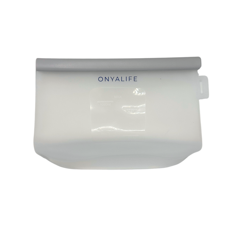 Reusable silicone food storage bag with flat base, pinch-seal top and slide-on sealing bar, showing measurement markings on translucent silicone.