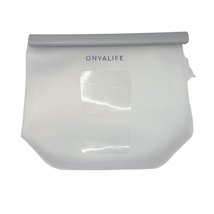 Reusable silicone food storage bag with flat base, pinch-seal top and slide-on sealing bar, showing measurement markings on translucent silicone.