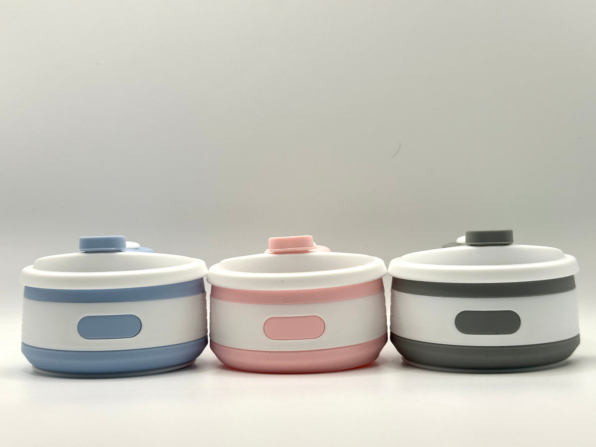 Collapsible 350ml silicone coffee cup with secure lid and heat-protective sleeve, shown expanded and collapsed with its reusable storage pouch. Shown in all three colours and collapsed