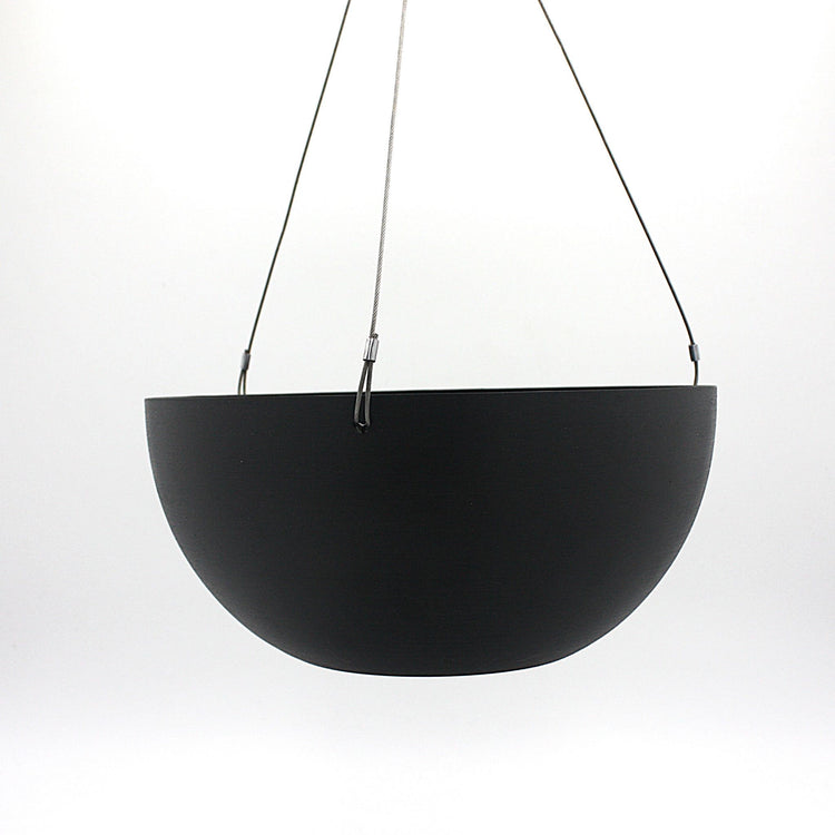 A hanging planter suspended by marine wire against a plain white background. Made from recycled plastic. Shown in Black