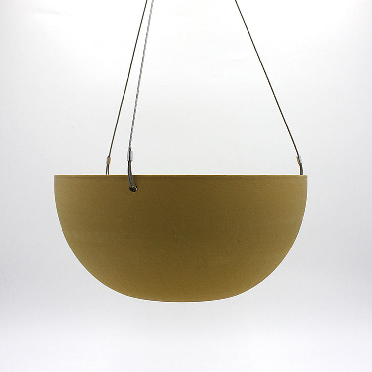 A hanging planter suspended by marine wire against a plain white background. Made from recycled plastic. Shown in Mustard