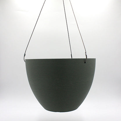 A hanging planter suspended by marine wire against a plain white background. Made from recycled plastic. Shown in Olive