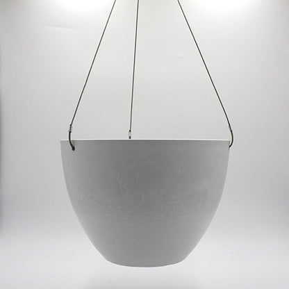 A hanging planter suspended by marine wire against a plain white background. Made from recycled plastic. Shown in White Stone