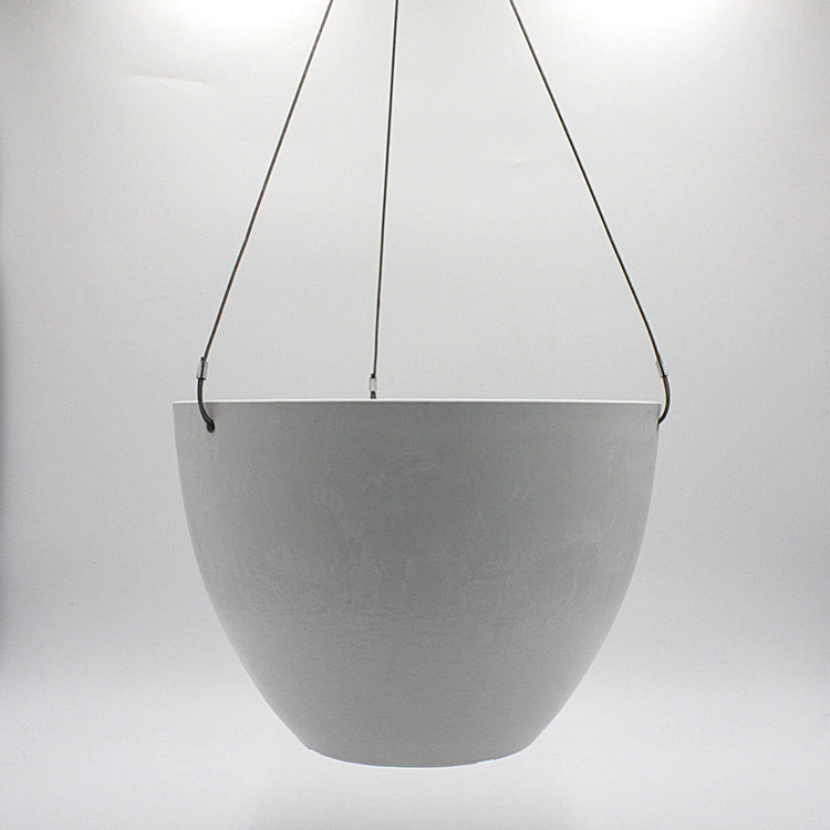 A hanging planter suspended by marine wire against a plain white background. Made from recycled plastic. Shown in White Stone